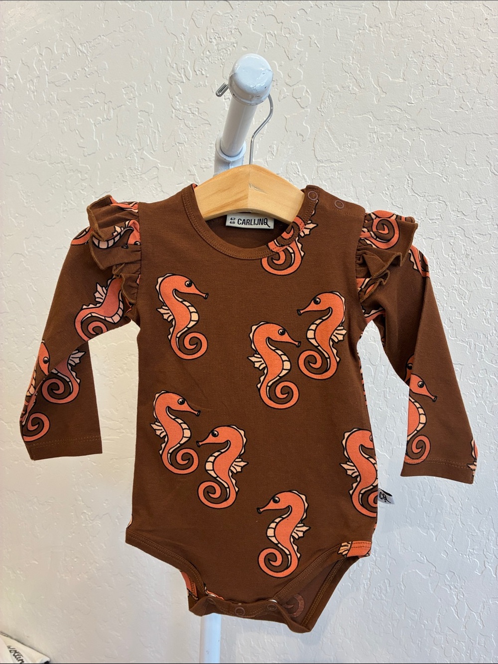 Brown Seahorse Ruffle-Shoulder Baby One-Piece